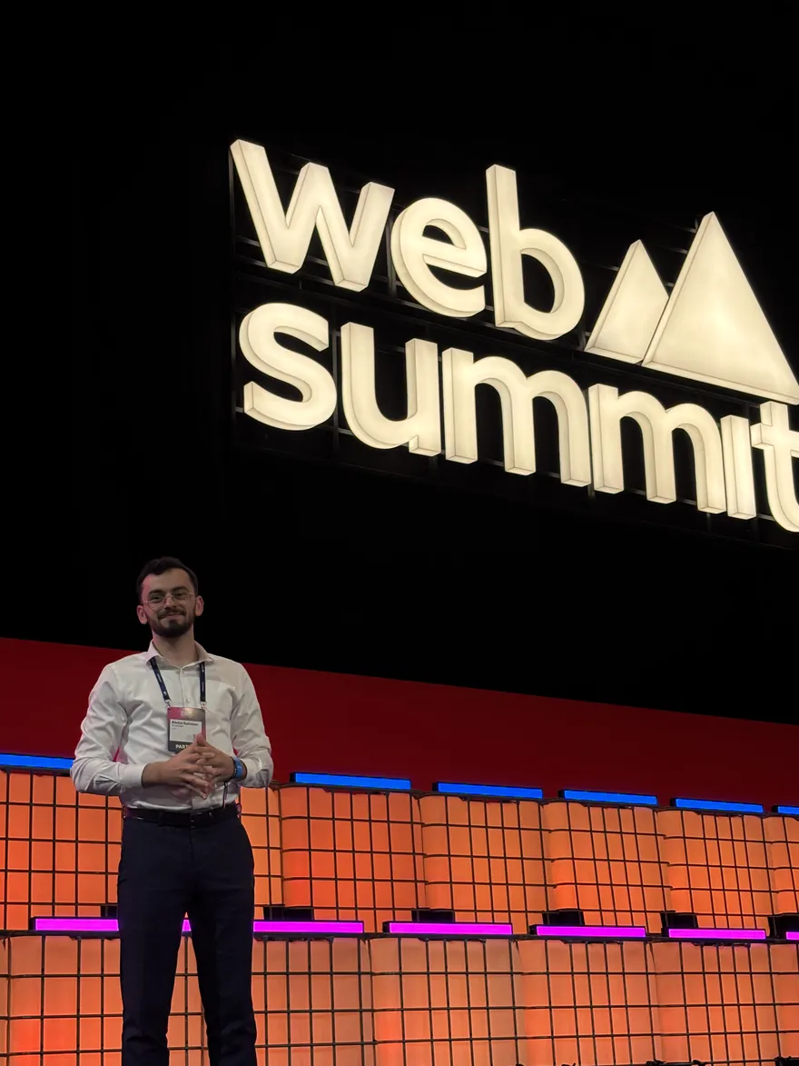 Standing on stage beneath the Web Summit sign